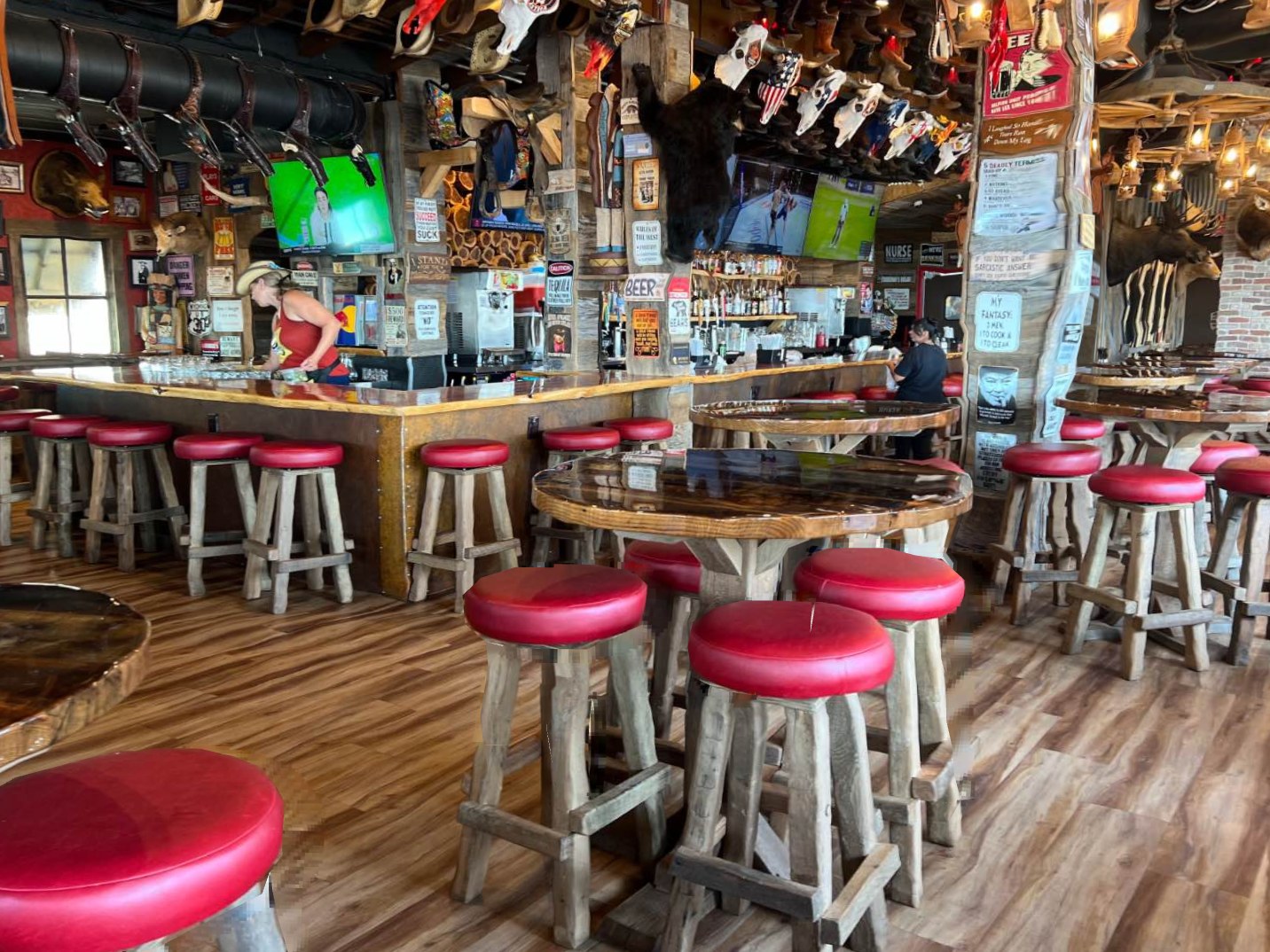 Doc Holliday's — bar area with red stools and western interior
