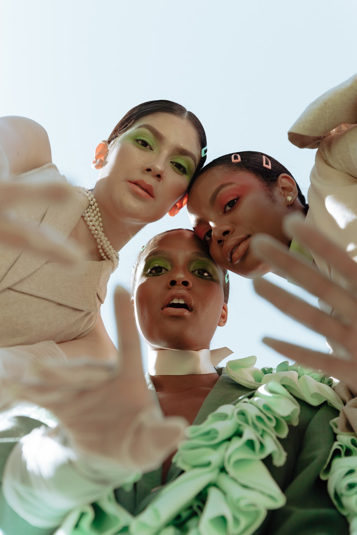 Beauty campaign — three models editorial close-up